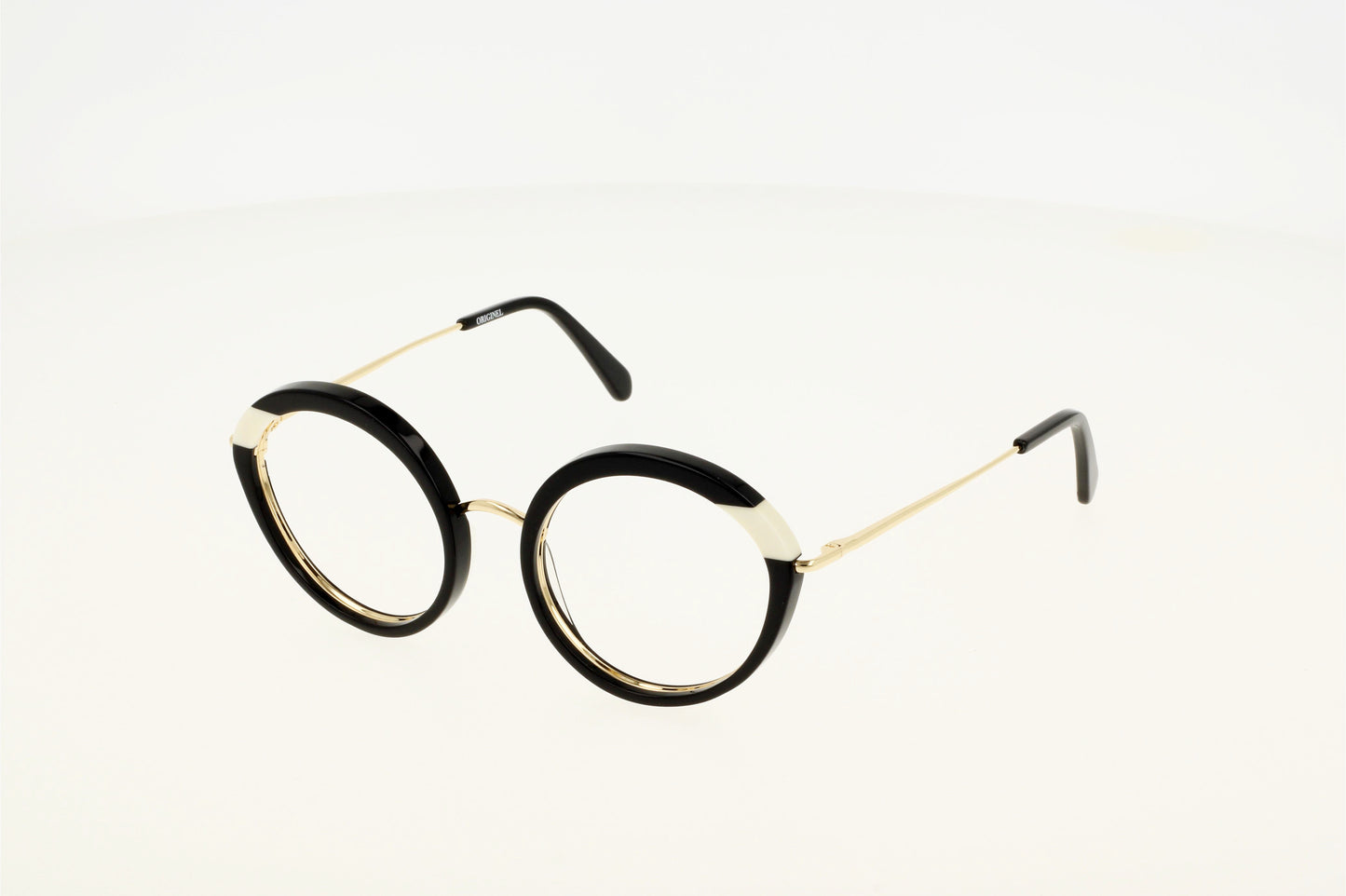 Lunette de vue noire et blanche, combinée acétate et métal, moderne, chic et tendance.