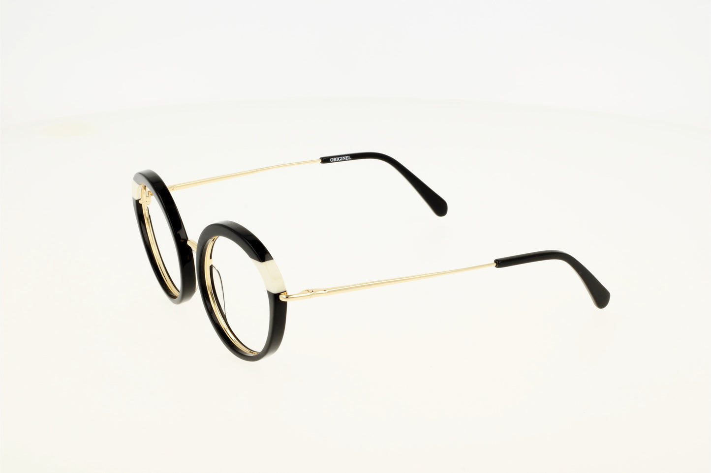 Lunette de vue noire et blanche, combinée acétate et métal, moderne, chic et tendance.