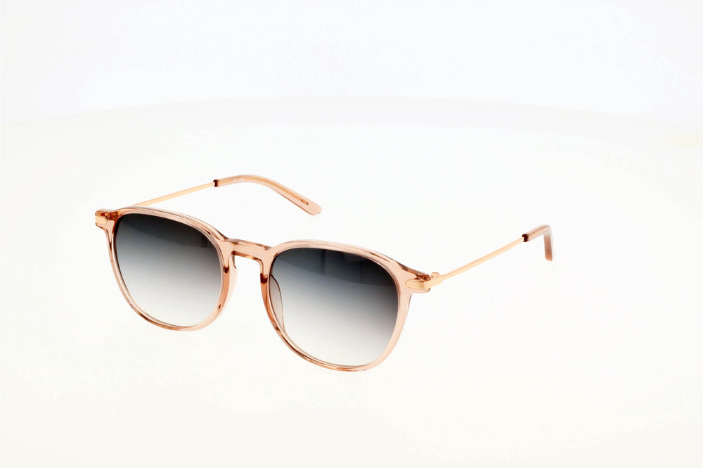 Originel eyewear France vous propose des lunettes de soleil tendance et moderne, de couleur rose transparent avec des branches dorées.